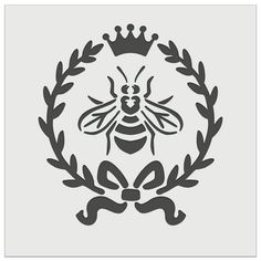 a bee with a crown on it's head sitting in front of a wreath