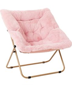 a pink chair sitting on top of a metal frame with a furry seat pad in front of it