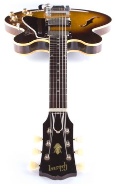 an electric guitar is shown with its neck and frets attached to the top of it