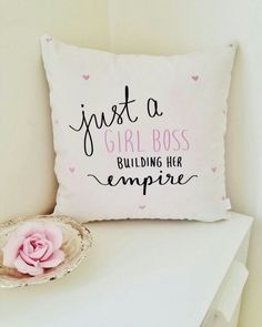 a pillow that says just a girl boss building her empire with a pink rose on it