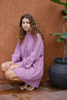 Introducing the Artist Smock, a collaboration between Audrey E Leary and World of Crow. This pink dual-tone smock is crafted from thick, handwoven organic cotton and features a straight collar, puff full sleeves, and spacious pockets. With a short length and gathered cuffs, it offers a comfortable fit and is perfect for painting, crafting, and staying cozy during travel. Relaxed Fit Cotton Tunic With Pockets, Cotton Tunic With Pockets And Relaxed Fit, Casual Tunic With Pockets For Daywear, Relaxed Fit Tunic With Pockets For Daywear, Casual Long Sleeve Tunic With Pockets, Casual Oversized Tunic With Pockets, Long Sleeve Tunic With Pockets For Daywear, Artist Smock, Handwoven Fabric