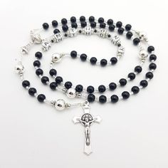 Personalised Rosary with black and silver beads. The black beads and light silver our father beads compliment each other. Choose from a wide range of centerpieces! This rosary is suitable for confirmation, first holy communions, christenings and more. Add a name and/or saint pendant to personalise. Please select whether you would like to a add name on the rosary from drop down menu then choose the centrepiece you would like as numbered in photos and select from drop down menu.  Use at mass or da Silver Rosary Bracelet With Black Round Beads, Silver Rosary With Black Beads As Gift, Adjustable Silver Rosary With Black Beads, Adjustable Silver Rosary Bracelet With Black Beads, Personalized Rosary, Custom Rosary, Praying The Rosary, Holy Rosary, Girl Christening