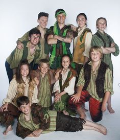 a group of people dressed in costumes posing for a photo