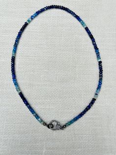 Necklace measures 17.5” Magnificent blue hues Beads measure 5mm Sterling silver clasp with diamonds Pendant sold separately Blue Sterling Silver Beaded Necklace With Gemstone Beads, Sterling Silver Blue Beaded Necklace With Polished Beads, Blue Gemstone Beaded Necklaces, Blue Sterling Silver Beaded Necklace With Polished Beads, Adjustable Beaded Necklaces With Sterling Silver Clasp, Blue Beaded Necklaces With Sterling Silver Clasp As Gift, Blue Beaded Rondelle Necklaces, Blue Sterling Silver Single Strand Jewelry, Blue Gemstone Beads Necklace In Sterling Silver