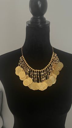 statement lira necklace with matching earrings Gold Necklace With Coin Pendant For Festival, Gold-tone Coin Shaped Metal Jewelry, Gold Costume Jewelry For Festival, Gold Bib Necklace Costume Jewelry, Gold-tone Metal Jewelry With Coin Pendant, Gold Costume Jewelry Bib Necklace, Bohemian Gold-tone Metal Jewelry, Elegant Gold-tone Coin Jewelry, Elegant Round Necklace For Festival