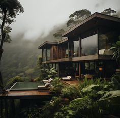 the house is surrounded by lush vegetation and trees