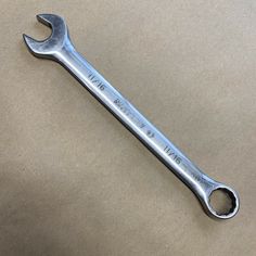 a wrench on a brown background with the words we are hiring