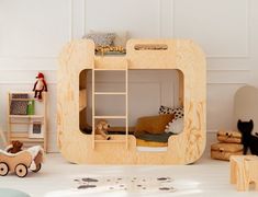 a child's bedroom with bunk beds and toys on the floor in front of it