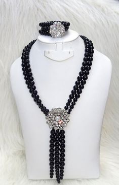 Handmade Black Beautiful Luscious Quality Pearls Necklace Bracelet Earring Jewellery Set UK Rapid dispatch Complete Set is Necklace Earring and bracelet Buying more that 1 Jewellery set, we offer wholesale and bulk prices for all our jewellery. Black Multi-strand Costume Jewelry, Elegant Black Adjustable Jewelry Sets, Multi-strand Black Beads Jewelry Gift, Elegant Black Beaded Crystal Jewelry, Multi-strand Polished Beads Jewelry For Parties, Black Crystal Jewelry For Jewelry Making, Formal Multi-strand Black Bead Jewelry, Costume Jewelry With Black Round Beads, Elegant Adjustable Crystal Beads