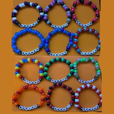 showcase your love for the beloved webcomic adventure, Homestuck, with these handcrafted Troll bracelets! Each bracelet features colors representing your favorite characters from the series, these bracelets are perfect for everyday wear or special occasions. Please note that due to the handmade nature of these items, bead colors and lengths may vary slightly from the photo displayed. Colorful Beads Rave Style Beaded Bracelets For Gifts, Multicolor Themed Stretch Bracelet For Friendship, Handmade Themed Bracelet With Round Beads, Handmade Stretch Bracelet For Rave Gift, Personalized Multicolor Beaded Bracelets For Rave, Personalized Rave Beaded Bracelets As Gift, Handmade Rave Stretch Bracelet As Gift, Personalized Rave Beaded Bracelets For Gifts, Rave Style Jewelry With Letter Beads As Gift