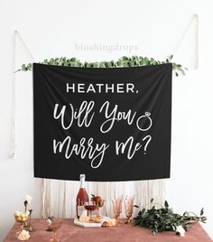 a black banner that says, whether will you marry me?