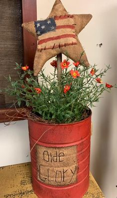 a potted plant with an american flag star on top and the words glue glory written on it