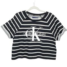 Calvin Klein Jeans Black White Striped Crop T-Shirt French Terry Logo Size Large. - Black White Stripe. - Cropped Length. - Short Sleeves. - Logo Front. - French Terry Cloth. New With Tags. Measurements (Approximate Flat Lay): Pit To Pit: 24" Length: 22" Calvin Klein Short Sleeve Streetwear Top, Calvin Klein Crew Neck Graphic Tee, Calvin Klein White T-shirt For Streetwear, Spring Calvin Klein Crew Neck Top, Calvin Klein Spring Crew Neck Top, Calvin Klein Graphic Print T-shirt For Summer, Calvin Klein Summer Graphic Print T-shirt, Sporty Calvin Klein Tops With Logo Print, Calvin Klein White Short Sleeve Top