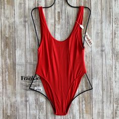 Frankie’s Bikinis Andi One Piece Style# 12122rb Size: X-Small Color: Red Retail $179 This Killer One-Piece Has A High Thigh Cut And An Open Back. Rock This Sleek And Slimming Suit Poolside, Or Pair With Denim For A Killer Outfit. Peek-A-Boo Cutout High Thigh Cut Skimpy Coverage 84% Nylon 16% Spandex Flat Fabric 82% Polyester 18% Spandex Crepe Fabric Genuine Authentic Brand New With Tags + Liner! Fitted Seamless Red Bodysuit, Fitted Red Seamless Bodysuit, Fitted Red Swimwear For Beach, Red Fitted Swimwear For Beach, Red Fitted Swimwear For The Beach, Fitted T-back Bodysuit For Beach Season, Seamless Red Bodysuit For Summer, Red Seamless Bodysuit For Summer, Fitted Red Swimwear For Vacation