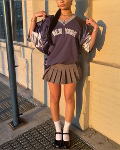 cute nyc based blokecore aesthetic outfit with thrifted jersey and mini skirt Jersey And Mini Skirt Outfit, Jersey Outfit Aesthetic, Blokecore Aesthetic, Black Tennis Skirt, American Football Jersey, Outfit Collage, Jersey Skirt, Miniskirt Outfits