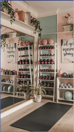 there is a yoga mat on the floor in front of some shelves with exercise balls