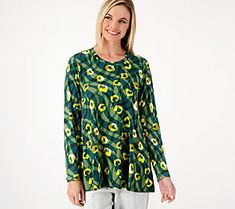 Bright colors and an eye-catching pattern add to the visual appeal of this scoop-neck swing top. Update your wardrobe with this fun, feminine style. From LOGO by Lori Goldstein®. Casual Printed Scoop Neck Tops, Spring Printed Top With Scoop Neck, Spring Scoop Neck Printed Top, Casual Green Tops With Bold Print, Casual Green Top With Bold Print, Spring Tops With Bold Print And Relaxed Fit, Casual Tops With Bold Print And Relaxed Fit, Casual Bold Print Relaxed Fit Top, Casual Spring Tops With Bold Print