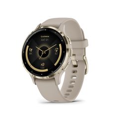 the garmin smart watch is shown in gold and grey with a black dial on its face