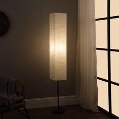 Elegant yet understated, this crystal Pluviam floor lamp is sure to please. The perfect addition to modern decor, this crystal floor lamp features a cylindrical glass drum with stacked imported crystal beading strands cascading like waterfall to a crisp off white linen shade with matte gold lining for a dramatic effect and creates a stunning and clean appeal. Sleek and stylish, this crystal column drum floor lamp is a living room or bedroom essential. Matte gold finish steel accents elegantly pl Floor Lamp Paper, Shoji Paper, Black Metal Floor Lamp, Novelty Floor Lamp, Paper Floor Lamp, Crystal Floor, Crystal Floor Lamp, Column Floor Lamp, Contemporary Floor Lamps