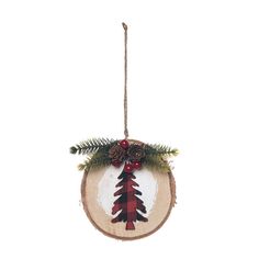 a wooden ornament with pine cones and berries hanging from a rope on a white background