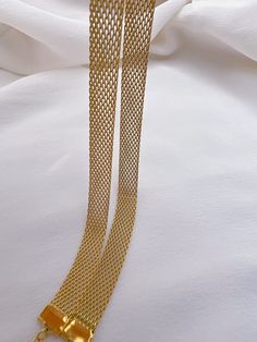 Description: Mesh chain necklace Material: 18k gold plated stainless steel Measurement: 13.5" length, 5cm extender chain, 8mm width, 1mm thickness Tarnish free, water resistant, hypoallergenic Mesh Chains Gold, Mesh Gold Chain, Mesh Chain Necklace Gold, Indian Gold Necklace Designs, Thick Gold Chain, Gold Necklace Indian, Gold Chain Design, Engagement Outfit, Jewelry Simple