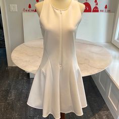 Brand New And Never Worn With Tags. Poly , Feels Like Neoprene Fabric. Fitted. Zipper Is From Collar To Navel. Ivory. 36” Long, 15” Bust. Fits A True 6 White Dress With Back Zipper For Day Out, Casual White Dress With Back Zipper, White Casual Mini Dress With Back Zipper, Casual White Mini Dress With Back Zipper, Neoprene Fabric, Theory Dress, Fit And Flare Dress, Flare Dress, Fit And Flare