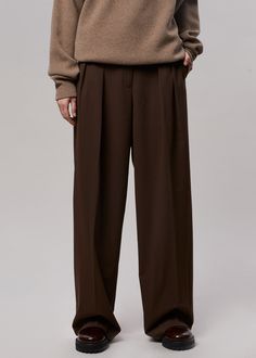 Color: Chocolate Soft woven suiting fabric with light stretch Baggy oversized silhouette Hook and bar closure Zip fly Unlined 72% Polyester 22% Rayon 4% Wool 2% Spandex Dry Clean By The Frankie Shop. Imported Product Measurements: S- 28" Waist, 46" Hip, 13.5" Rise, 31" Inseam M- 30" Waist, 48" Hip, 13.75" Rise, 31.5" Inseam L- 32" Waist, 50" Hip, 14" Rise, 32" Inseam Model is 175cm/5'9" wearing size S Mens Pleated Pants, Brown Pants Men, Slacks Outfit, Pants Outfit Men, Classy Outfits Men, Suiting Fabric, The Frankie Shop