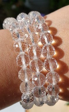 This listing is for 1, Beautiful Facet Quartz Crystal Bracelet. Perfect for stacking, along side a watch or by itself. Absolutely stunning sparkle with every turn! Great gift or addition for your own collection. 🌐METAPHYSICAL PROPERTIES, LORE, USES: Clear Quartz is often used to cleanse, open, activate, and align all of the chakras. Since Clear Quartz absorbs energies very easily, it is important to clear these stones on a regular basis. In natural form, Clear Quartz Points radiate their energi Adjustable Stackable Crystal Bracelet, Adjustable Stackable Round Crystal Bracelet, Crystal Bracelets For Gifts, Sparkling Round Bead Bracelets For Gifts, Adjustable Faceted Crystal Bracelet, Adjustable Faceted Round Crystal Bracelet, Elegant Clear Round Beaded Bracelets, Clear Faceted Beads Bracelet As Gift, Clear Faceted Beads Bracelets As Gift