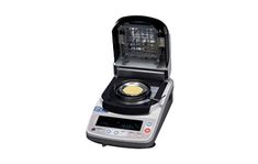 an electronic food scale with a pan on it's burner and the lid open