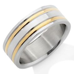 two tone gold and silver wedding ring with three stripes on the inside, set against a white background