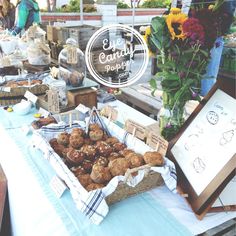 a table filled with lots of food and flowers