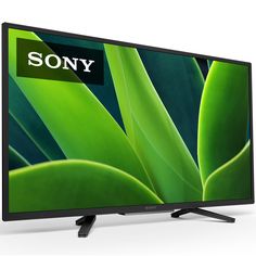 a flat screen tv with the sony logo on it's side and an image of a green plant behind it