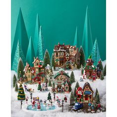 a christmas village with lots of trees and houses