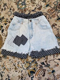 "THESE SHORTS HAVE IT ALL! Ultra high-waisted. Polka-dot patchwork. Fringe. Acid-wash. Many pockets in front and back. The polka-dot fabric on top and bottom is sewn in and does not cover the whole inside of shorts. Top polka- dot waist buttons as well and has elastic. In Excellent Vintage Condition with no visible flaws. No brand label or size label. Measurements: Waist (polkadot): 24\" - 30\" Waist (denim): 26\" Hips: approx 40\" Rise: 14\" to top of polkadot Inseam: 4\" to bottom of polkadot High Waist Cotton Patchwork Shorts, Patchwork Shorts Denim, Multicolor Patchwork Cotton Shorts, Denim Blue Patchwork Shorts, Retro Patchwork Cotton Shorts, Patchwork Shorts, Polka Dot Fabric, Acid Wash, No Brand