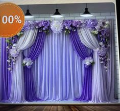 an image of a purple and white backdrop with flowers on the side for a sale