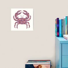 there is a crab on the wall next to a blue dresser and bookshelf