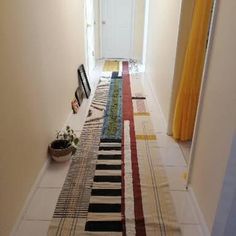 the hallway is clean and ready to be used as a place for pictures or other things