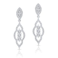 These ornate white gold earrings swing gracefully from your ears in long arcs, covered with small sparkling diamonds. Elegant Diamond White Linear Earrings With Prong Setting, Elegant Diamond White Linear Earrings, Classic White Gold Diamond Chandelier Earrings, Elegant White Gold Dangle Diamond Earrings, Elegant White Gold Bridal Earrings With Diamond Cut, Classic Diamond White Chandelier Earrings With Diamond Accents, Classic Diamond White Chandelier Earrings, Timeless Linear Earrings With Diamond Accents For Wedding, Elegant Diamond Linear Earrings For Anniversary