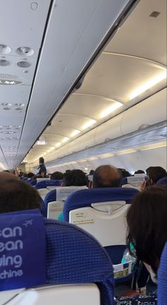 people are sitting in seats on an airplane