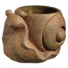 a clay vase with a snail on it's head and eyes closed to the side