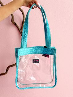 This In the Clear Tiffany Bubble Gator Mini Tote is a beautiful bubble gator exterior. Each handcrafted bag has the option of coming with a matching zipper. This Mini Tote is available now for Pre-Order! Please allow up to 15 business days for Makeup Junkie Pre-Orders to be made-to-order. This processing time does not include the time it takes for your order to ship. Exterior: Tiffany Bubble Gator Zipper: Sparkle Silver LIFETIME WARRANTY through Makeup Junkie Bags Consuela Bags, Foldover Bag, Clear Purses, Vinyl Trim, Travel Handbags, Go Bags, Handcrafted Bags, Tool Bag, Mini Tote