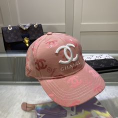 SHOP MORE LUXURY PRODUCTS HERE Description Chanel Cap Pink Chanel branded Cap with a dynamic and youthful design PinkPink FabricCC Logo Includes box, dust bag.This product is of the premium quality. Chanel Cap, Chanel Suit, Lil Black Dress, Louis Vuitton Shirt, Chanel Shirt, Branded Caps, Chanel Brand, Chanel Necklace, Long Gold Earrings