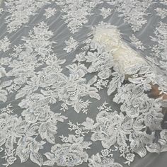 "Beaded Embroidery Lace Fabric . It's perfect for weddings, bridal parties, and any events. Shop our large inventory of bridal fabrics. ☆PRODUCT DESCRIPTION : The fabric width is approximately 51\" (130 cm) Wide. Length: 1 Yard, If you buy more than 1 yard, I will send you a whole piece of fabric uncut. Color: Off-White Material: Polyester Yarn, Off-White Beads, Transparent Sequin. 8012 ☆ PURCHASING INFORMATION: This fabric is sold by the yard and each Qty you enter will represent 1 yard of fabr Embellished Tulle Fabric For Wedding, Tulle Wedding Dress With Lace Work, Wedding Tulle Fabric With Pearl Embroidery, Wedding Tulle Fabric With Delicate Lace, Lace Wedding Dress With Sequins, Wedding Tulle Fabric With Lace Work, Lace Wedding Dress With Pearl Embroidery For Bride, Wedding Tulle Fabric With Floral Embroidery, White Sequin Tulle Fabric For Wedding