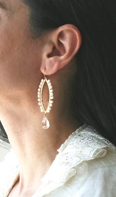 It's pearls all around in these unique bridal earrings. For the bride who wants something different on her big day, these earrings offer a modern take on pearls and crystals. + Freshwater Pearls. Crystal Quartz. 14K Gold Fill Ear Wire. 14K Gold Plate Finding. + Length: 2.75 inches. + Earrings are ready to ship. + Your jewelry will come in a jewelry box, tied with a ribbon. ➤➤ Have a question about this product, reach out to me here ➙ https://www.etsy.com/conversations/new?with_id=9057464&ref Pearl White Chandelier Earrings With Pearl Drop For Anniversary, Pearl White Pearl Drop Chandelier Earrings For Anniversary, Pearl White Chandelier Earrings For Anniversary, Pearl Chandelier Earrings With Pearl Chain For Wedding, Pearl Chandelier Earrings For Wedding, Wedding Chandelier Earrings With Pearl Chain, Pearl White Teardrop Chandelier Earrings For Wedding, Graceful Teardrop Pearl Earrings For Weddings, Teardrop Pearl Embellished Bridal Earrings