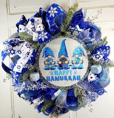 a happy hanukkah wreath with blue and white decorations