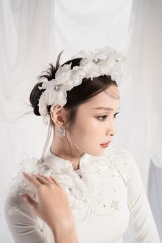 A beautiful traditional dress is always the desire of every girl. Sophisticated and meticulous embellishments, crystals, and pearls together with flowers are very sharp, making the Ao Dai always the center of attention. It is a perfect choice for the big occasion. Note:*Processing time takes 11-14 working days (including 8-10 working days for manufacturing and NOT including shipping time)**Backorder Definition- The product is low in stock and in case the customer purchased successfully after out Elegant Adjustable Bridal Accessories, Pearl White Pearl Bridal Accessories, Elegant Adjustable Hair Accessories For Ceremony, Elegant Party Headpiece With Flower Decoration, Elegant Hair Accessories With Handmade Flowers And Adjustable Fit, Elegant Adjustable Hair Accessories With Handmade Flowers, Elegant Crown Headpiece For Evening, Elegant Headband For Ceremony, Elegant Handmade Flower Hair Accessories For Formal Events