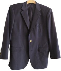 Vintage Brooks Brothers classic navy blue wool blazer with embossed logo buttons. Two-button, single vent sport coat with two front pockets. Loro Piana luxury wool, super 120's. Size 41R. Armpit to armpit 22.5" Sleeve (shoulder seam to cuff) 24" Length in back 31" Very good condition. No stains, tears or repairs. Smoke free, pet free MADE IN THE USA Vintage Brooks Brothers, Mens Blazers, Blazer Men, Mens Sport Coat, Loro Piana, Blazers For Men, Blue Wool, Wool Blazer, Gold Buttons