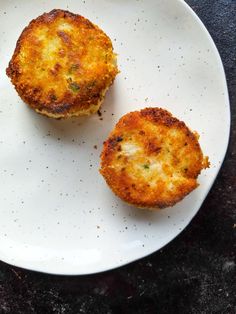 two fried food items on a white plate