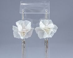 Beautiful and elegant earrings with white hydrangea flowers. The flowers have a pearlescent sheen complemented by long tassels. Ideal for brides and other special occasions. When wearing floral jewelry, you emphasize your natural beauty! The flowers are made by hand from special floral polymer clay, painted with professional pastel and covered with a protective varnish. ❀ Dimensions: - Flowers size about 1.18 inches (3 cm) - Earrings total length 4.33 inches (11 cm) ❀ Materials: - Japanese flora Elegant White Earrings With 3d Flowers, Elegant White 3d Flower Earrings, Elegant White Flower-shaped Earrings, Pearl White Flower-shaped Earrings For Party, Elegant Pearl White Flower-shaped Earrings, Floral Polymer Clay, Evening Fashion, Hydrangea Flowers, Floral Jewelry