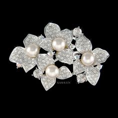 "PERFECT GIFT /WEDDING GIFT FOR BRIDE / BRIDESMAID / LADY! Great Accent for your Wedding Dress! This sparkling PEARL Flower Cluster Brooch made with Swarovski crystals measuring 2 3/8\" wide X 1 5/8\" high (60mm X 41mm). Crystal Color: Crystal Clear Great piece for your collection! Prices are in US$. For shipping policies and other important information, click on \"profile\" on the right. See an item that you like but has already been sold? Contact me to see if I have more! Thank you for stoppin Vintage White Wedding Brooches, Silver Flower Brooch For Wedding, Silver Wedding Brooch With Flower Decoration, Silver Wedding Brooches With Flower Decoration, Silver Flower Wedding Brooches, Brooch Outfits, Chanel Brooch, Tree Jewelry, Brooch Flower